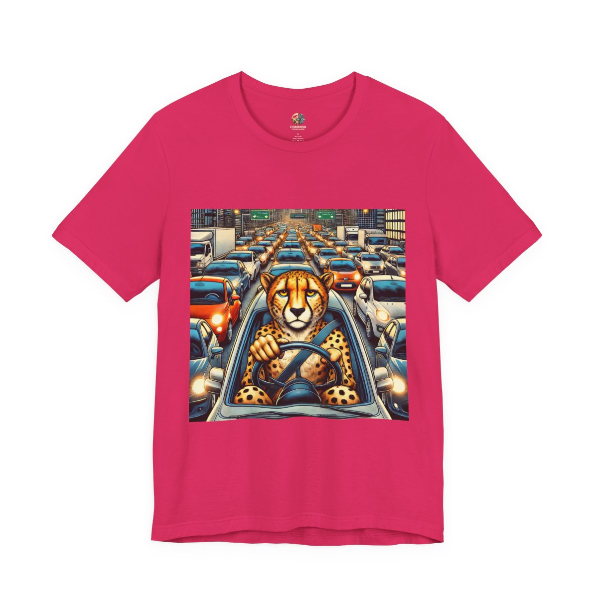 Fuchsia T-shirt featuring a graphic of a cheetah sitting in the driver’s seat of a car stuck in heavy city traffic